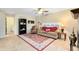 A cozy living room with a sofa, armchair, and a large area rug at 4674 Hall Rd, Orlando, FL 32817