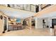 Spacious living room features a soaring ceiling, neutral paint, and beautiful tile flooring at 4674 Hall Rd, Orlando, FL 32817