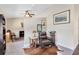 Cozy home office area with neutral walls, chair, and golf clubs at 4674 Hall Rd, Orlando, FL 32817