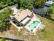 A rear view showing a beautiful pool, patio, and landscaping at 4674 Hall Rd, Orlando, FL 32817
