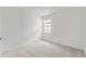 Cozy bedroom has neutral carpet and a window offering natural light at 499 Silver Palm Dr, Haines City, FL 33844