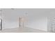 Bright, open living room showcasing tile flooring and neutral walls at 499 Silver Palm Dr, Haines City, FL 33844