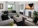 Inviting living room with a comfortable sofa, an entertainment center, and large windows with views of nature at 499 Silver Palm Dr, Haines City, FL 33844