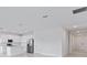 Open-concept living space connects kitchen and entryway, perfect for entertaining at 499 Silver Palm Dr, Haines City, FL 33844