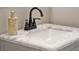 Bathroom sink featuring a marble countertop and a stylish faucet at 501 Water St # 501, Celebration, FL 34747