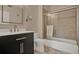 Well-lit bathroom featuring a shower-tub combination and a stylish dark vanity at 501 Water St # 501, Celebration, FL 34747