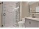 Bathroom featuring a modern shower stall and a gray vanity with sink at 501 Water St # 501, Celebration, FL 34747