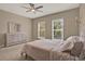 Bedroom with carpet flooring, a dresser, and large windows offering plenty of natural light at 501 Water St # 501, Celebration, FL 34747