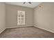 Cozy carpeted bedroom with natural light; ideal for relaxing and unwinding at 501 Water St # 501, Celebration, FL 34747