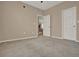 A carpeted bedroom offering ample space and natural light from an open doorway at 501 Water St # 501, Celebration, FL 34747