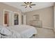 Bedroom featuring neutral walls, carpet flooring, a dresser, and a walk-in closet at 501 Water St # 501, Celebration, FL 34747