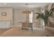 Elegant dining area features a wooden table, seating for four, and an eye-catching light fixture at 501 Water St # 501, Celebration, FL 34747