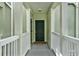 Inviting walkway leading to unit, featuring a dark door, welcome mat and painted railings at 501 Water St # 501, Celebration, FL 34747