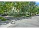 Beautiful green exterior of this multi-story home with manicured landscaping at 501 Water St # 501, Celebration, FL 34747