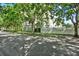 Apartment building exterior; surrounded by lush trees and a street at 501 Water St # 501, Celebration, FL 34747
