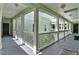 Exterior hallway with railings overlooking courtyard and doors to apartments at 501 Water St # 501, Celebration, FL 34747