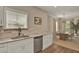 Bright kitchen features granite countertops, stainless steel appliances, and an open view to dining area at 501 Water St # 501, Celebration, FL 34747