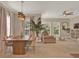 Inviting living room with plush seating, large windows with natural light, and a decorative pendant light at 501 Water St # 501, Celebration, FL 34747