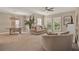 Bright living and dining area with carpet, neutral tones, and lots of light at 501 Water St # 501, Celebration, FL 34747