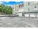 Apartment building exterior with parking lot, including a few parked vehicles at 501 Water St # 501, Celebration, FL 34747