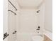 Bright bathroom features a tub and shower combination with sleek, modern fixtures at 5037 Water Wheel Ct, Ocoee, FL 34761