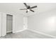 Spacious bedroom features hardwood floors, a ceiling fan, and closet space at 5037 Water Wheel Ct, Ocoee, FL 34761
