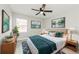 Bedroom with large bed, blue accents, and plants that create a calming retreat at 5037 Water Wheel Ct, Ocoee, FL 34761