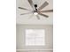 Bedroom with hardwood floors, natural light, and a modern ceiling fan fixture at 5037 Water Wheel Ct, Ocoee, FL 34761