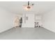 Clean, empty garage with painted floor offers ample storage and utility space at 5037 Water Wheel Ct, Ocoee, FL 34761