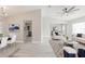 Open-concept living and dining area with modern decor and plenty of natural light at 5037 Water Wheel Ct, Ocoee, FL 34761