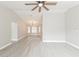 Bright living room with vaulted ceilings and wood-look floors at 5037 Water Wheel Ct, Ocoee, FL 34761