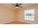 Bedroom featuring window with view and ceiling fan at 513 N Pine Meadow Dr, Debary, FL 32713