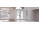 Entryway featuring frosted glass double doors, a large window, and tile flooring at 513 N Pine Meadow Dr, Debary, FL 32713