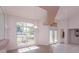 Foyer area with tile flooring, a large window, and decorative glass double doors at 513 N Pine Meadow Dr, Debary, FL 32713