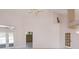 Bright living room with high ceilings, ceiling fan, and views to the pool at 513 N Pine Meadow Dr, Debary, FL 32713