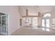 Bright and airy living space with unique architecture, including an arched window and tile accents at 513 N Pine Meadow Dr, Debary, FL 32713
