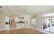 Spacious living space featuring an open-concept design combining the kitchen, dining, and living areas at 513 N Pine Meadow Dr, Debary, FL 32713