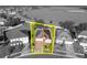 An aerial view of the home highlighted with a yellow border showing property lines at 5273 Sunset Canyon Dr, Kissimmee, FL 34758