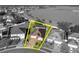 An aerial view of the home highlighted with a yellow border showing property lines at 5273 Sunset Canyon Dr, Kissimmee, FL 34758