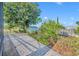 Landscaped backyard featuring paver walkway and beautiful plants at 5273 Sunset Canyon Dr, Kissimmee, FL 34758