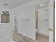 Bright bathroom hallway with views of bedroom, walk-in closet, linen closet and shower at 5273 Sunset Canyon Dr, Kissimmee, FL 34758