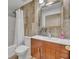 Bathroom featuring a vanity and mirror as well as a shower with curtain at 5273 Sunset Canyon Dr, Kissimmee, FL 34758