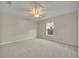 Large bedroom featuring neutral colors, a ceiling fan, and a window at 5273 Sunset Canyon Dr, Kissimmee, FL 34758