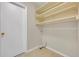 A closet with several shelves and a door at 5273 Sunset Canyon Dr, Kissimmee, FL 34758
