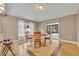 Dining room features a round table, chairs, sliding doors and updated floors at 5273 Sunset Canyon Dr, Kissimmee, FL 34758