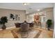 Open dining room featuring a round table, stylish chairs and an open view into the kitchen at 5273 Sunset Canyon Dr, Kissimmee, FL 34758