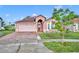 A lovely single-Gathering home with a well-kept lawn and appealing curb appeal under a clear sky at 5273 Sunset Canyon Dr, Kissimmee, FL 34758