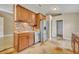 Kitchen with stainless steel appliances, wood cabinets, tile backsplash and sink at 5273 Sunset Canyon Dr, Kissimmee, FL 34758