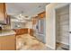 Kitchen features stainless appliances, wood cabinets, a pantry and granite countertops at 5273 Sunset Canyon Dr, Kissimmee, FL 34758