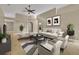 Stylishly furnished living room with neutral tones, modern furniture, and ample space for relaxation and entertainment at 5273 Sunset Canyon Dr, Kissimmee, FL 34758